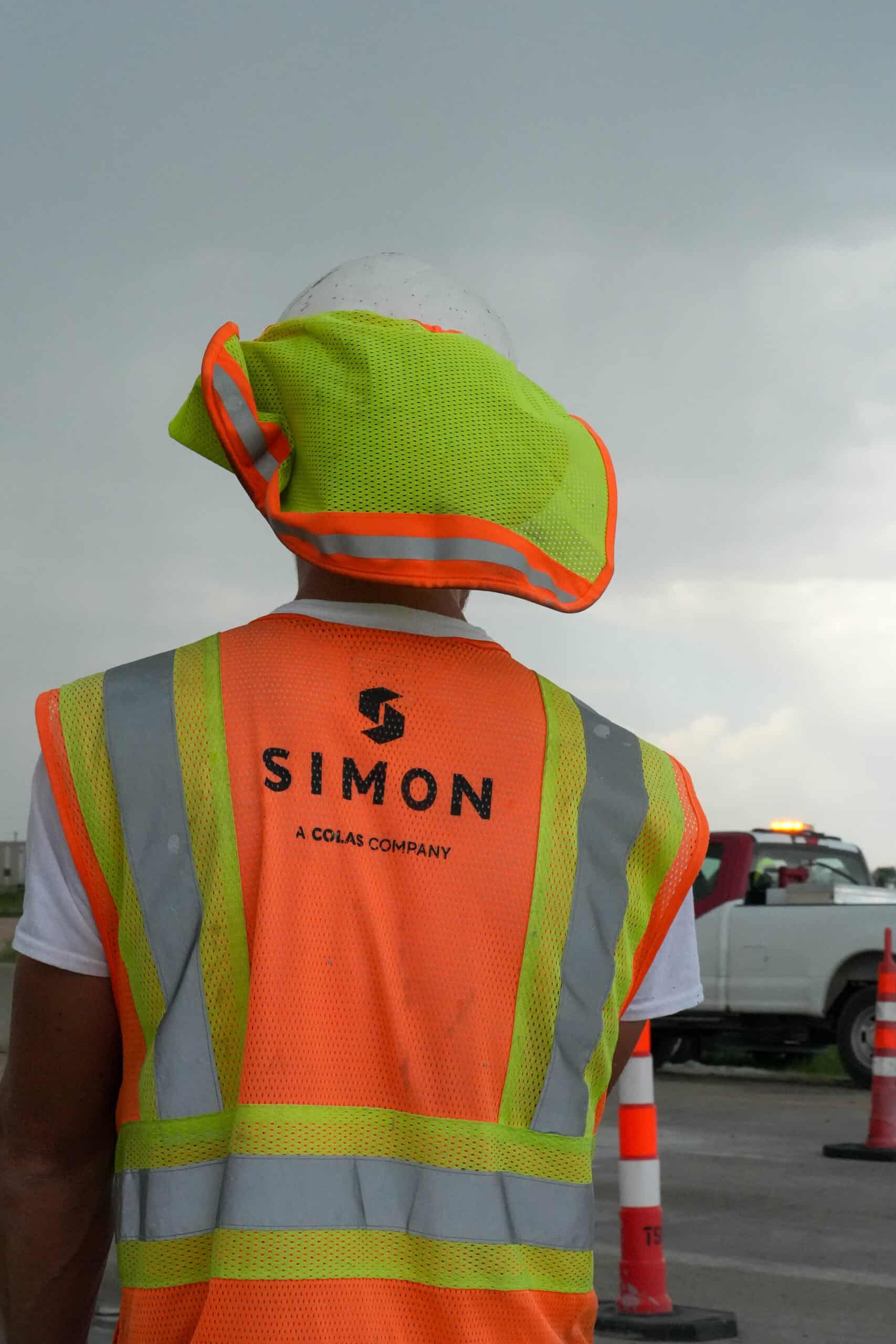Man with orange construction vest on.