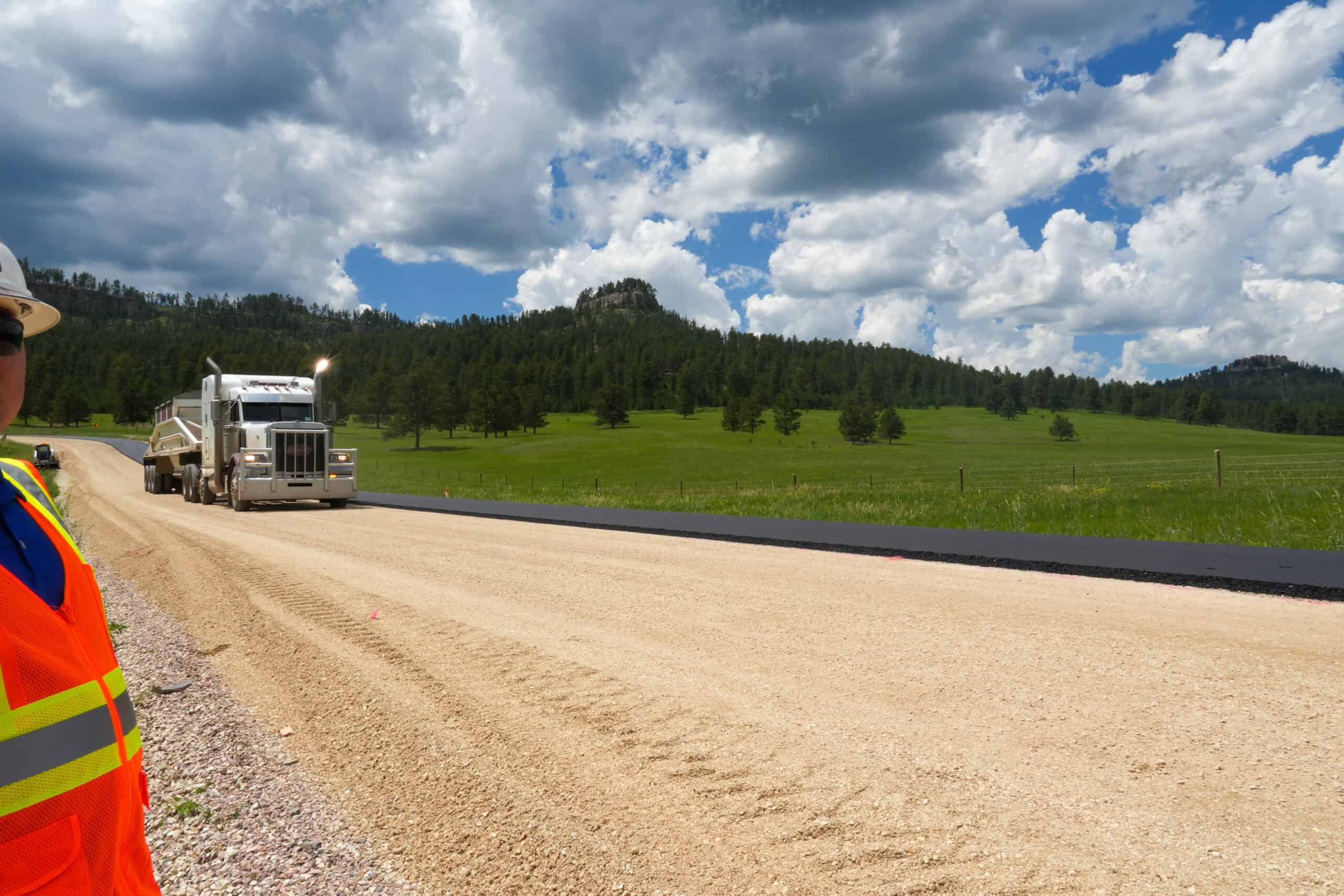 Truck on gravel road.