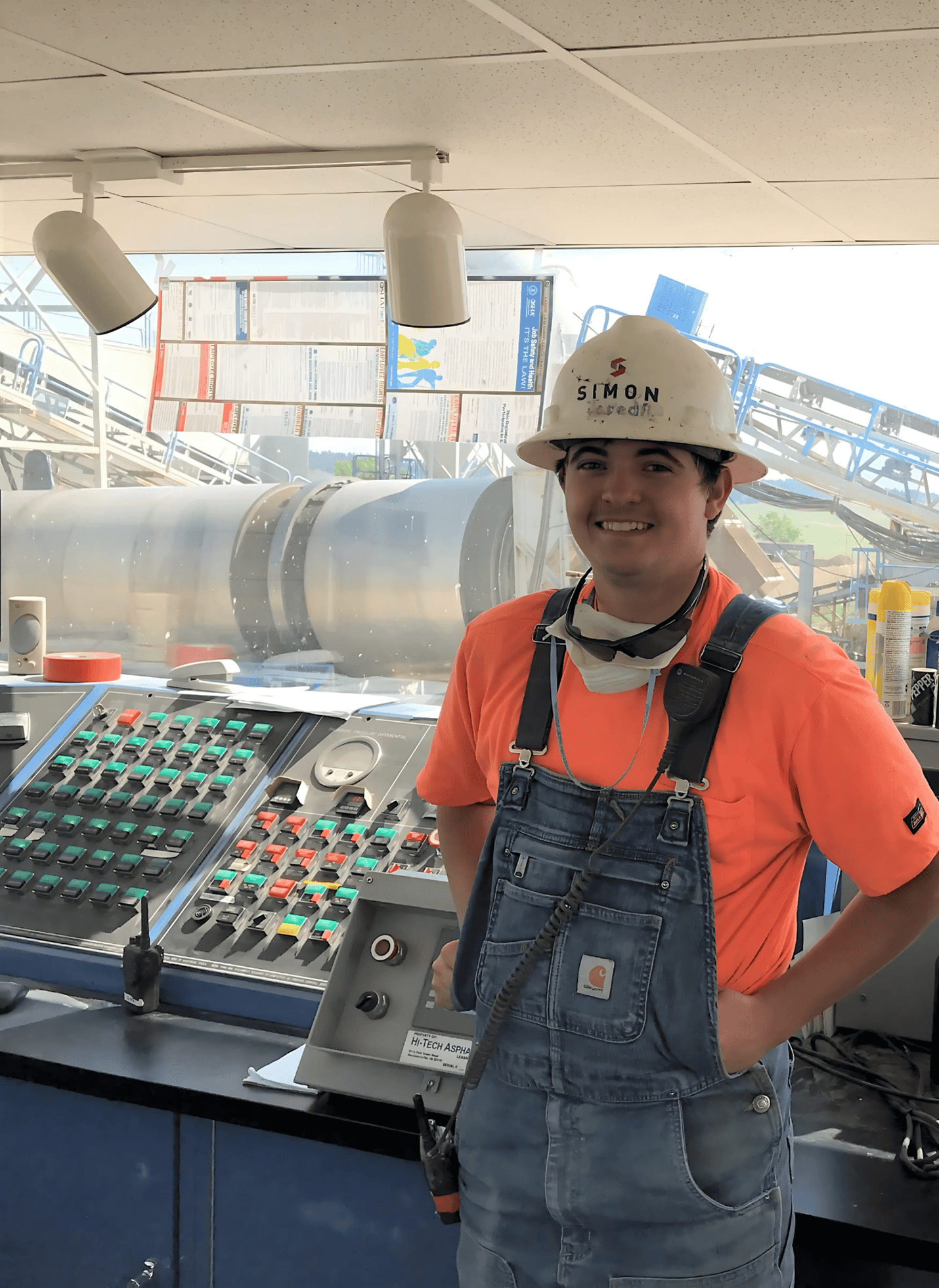 Jared smiling in front of control panel.